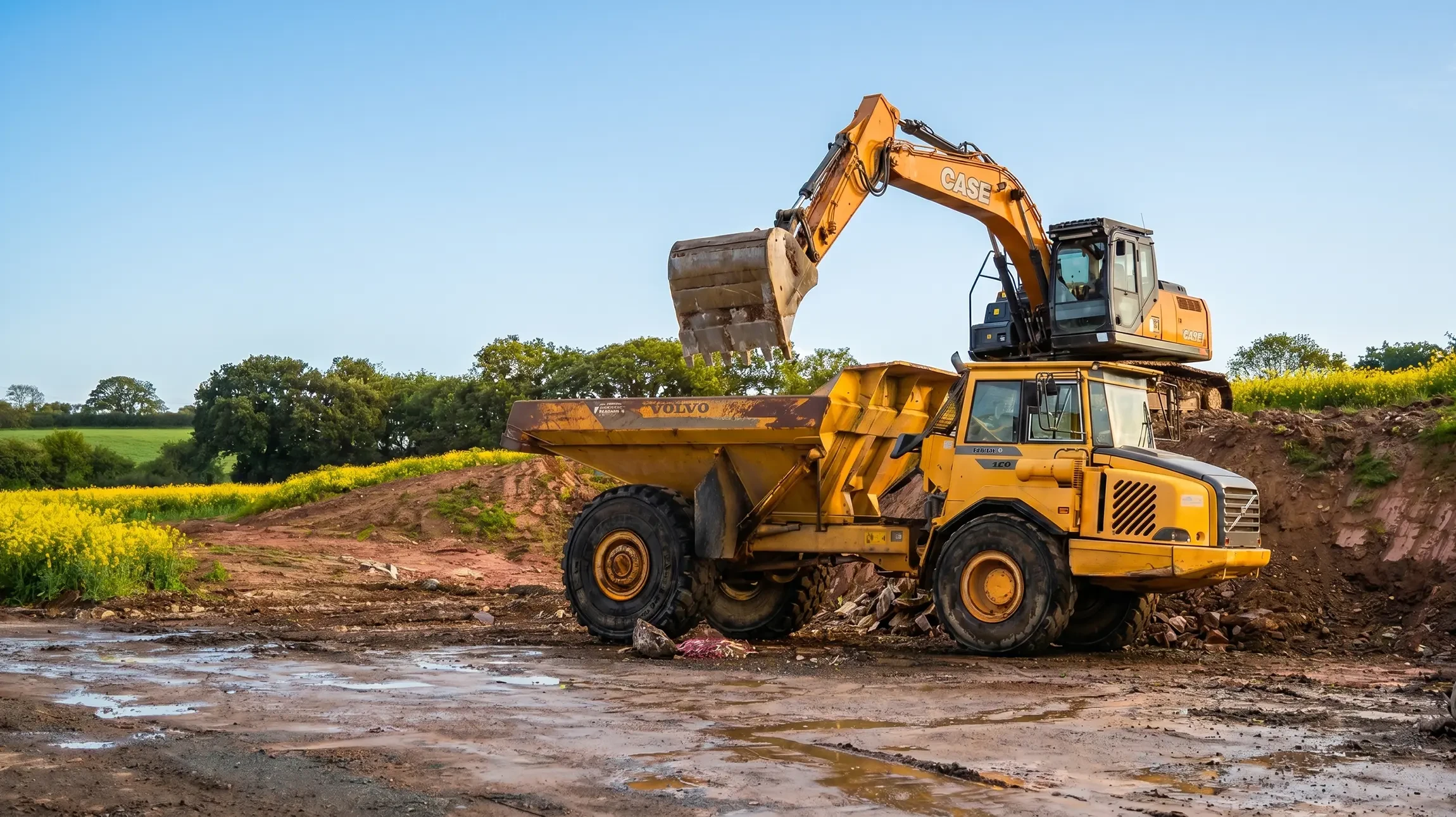 Chantier de terrassement en plein air avec pelleteuses hydrauliques jaunes en activité